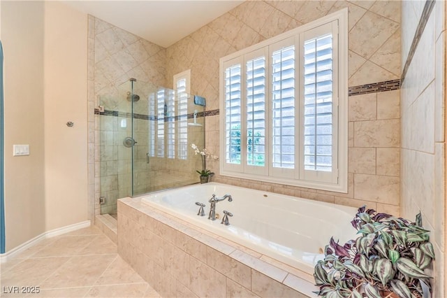 full bathroom with a stall shower, baseboards, a garden tub, and tile patterned floors