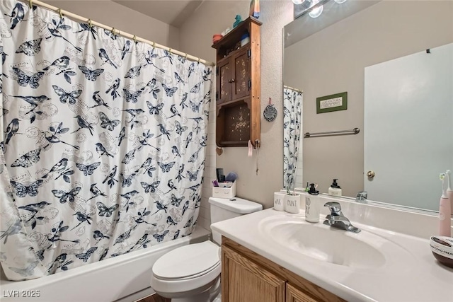 bathroom with shower / bath combo, vanity, and toilet