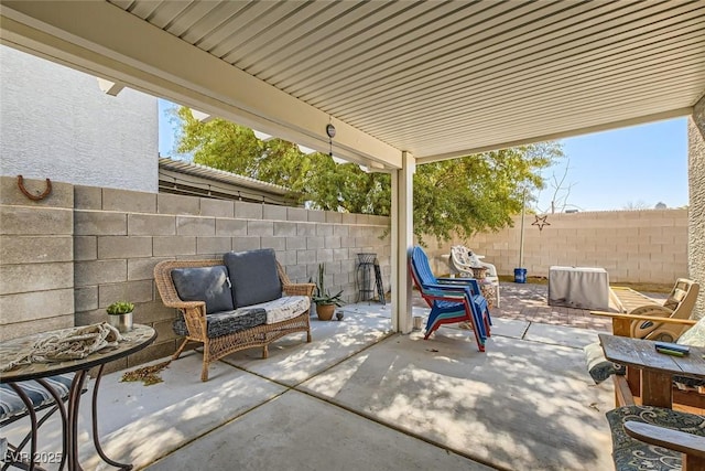 view of patio / terrace featuring fence