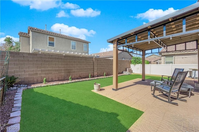 view of yard featuring a patio area and a fenced backyard