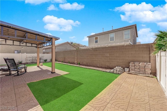 view of yard featuring a patio area and a fenced backyard