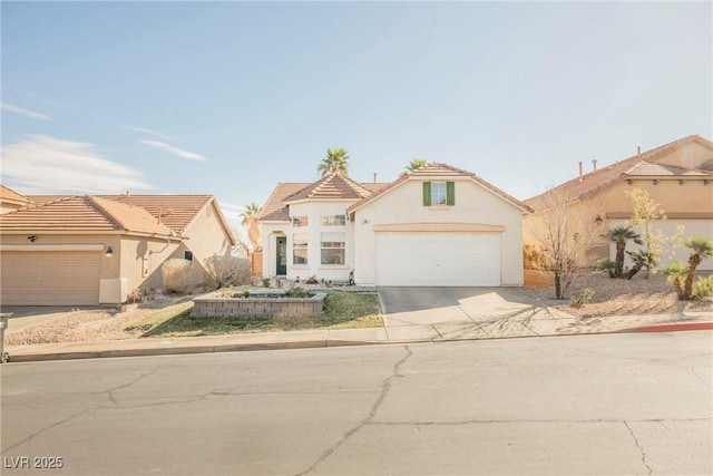 mediterranean / spanish-style house featuring a garage, driveway, a tiled roof, and stucco siding