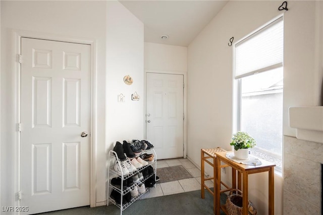 interior space with a wealth of natural light and light tile patterned flooring