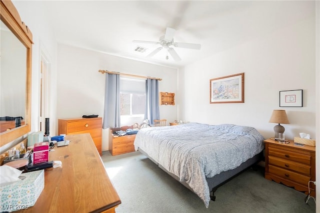 bedroom with carpet floors, ceiling fan, and visible vents