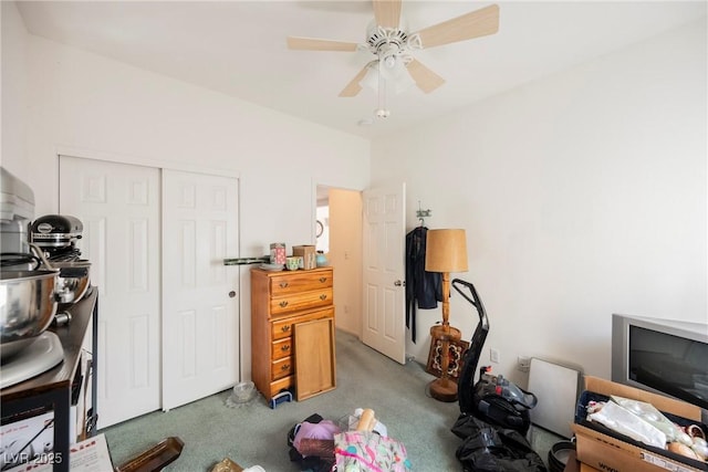 office with a ceiling fan and light colored carpet