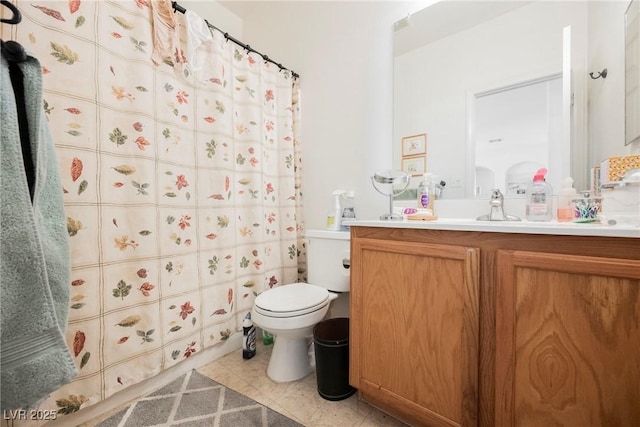 bathroom featuring toilet, tile patterned floors, a shower with curtain, and vanity