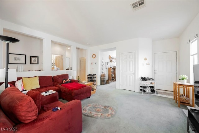 living room with carpet floors and visible vents