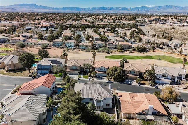 birds eye view of property featuring a mountain view, golf course view, and a residential view