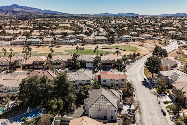 drone / aerial view featuring a residential view and a mountain view