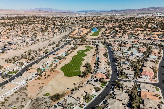 drone / aerial view featuring a residential view, a desert view, and a mountain view