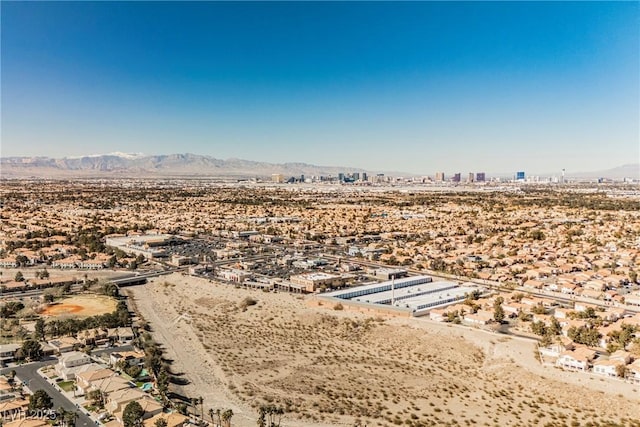 birds eye view of property featuring a mountain view and a desert view