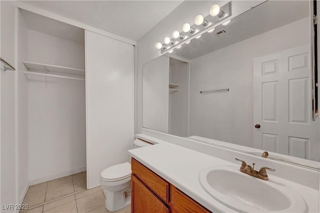 bathroom featuring visible vents, vanity, toilet, and tile patterned floors