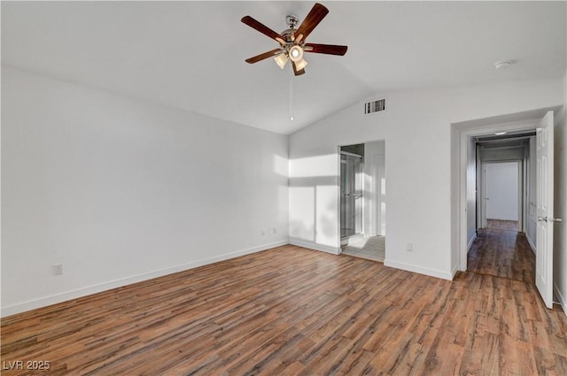 unfurnished bedroom featuring lofted ceiling, ceiling fan, wood finished floors, visible vents, and baseboards