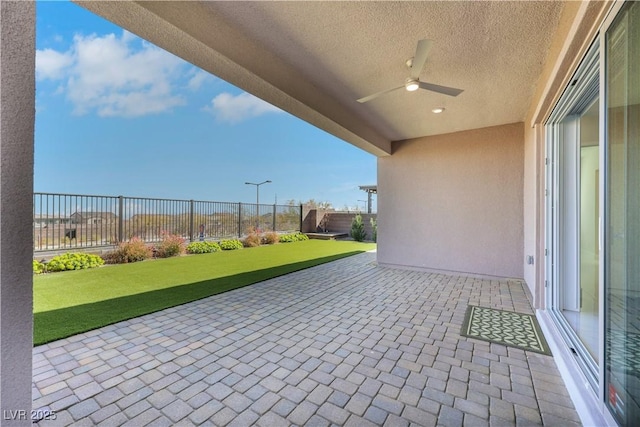 view of patio with ceiling fan and a fenced backyard