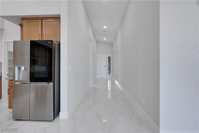 hall featuring marble finish floor, recessed lighting, and baseboards