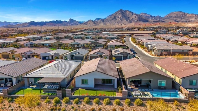 drone / aerial view with a residential view and a mountain view