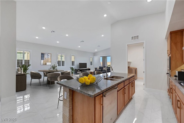 kitchen featuring stainless steel appliances, marble finish floor, visible vents, and a sink