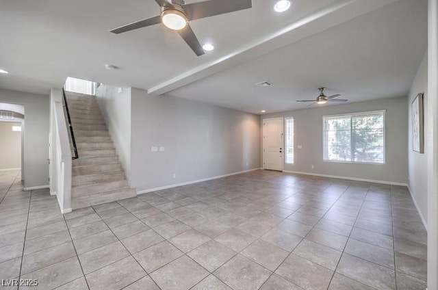 unfurnished living room with recessed lighting, baseboards, stairway, and light tile patterned flooring