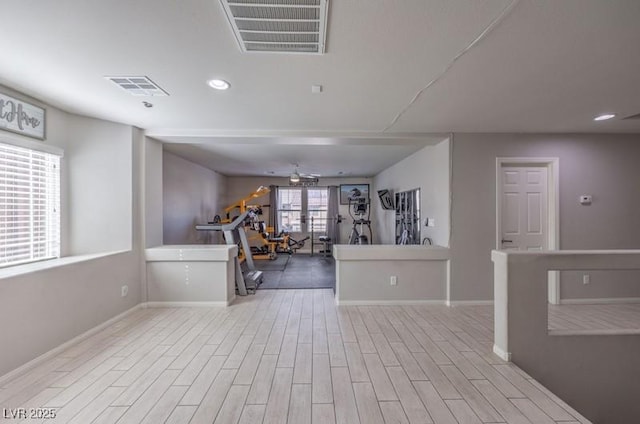 workout room featuring visible vents, wood finished floors, and recessed lighting