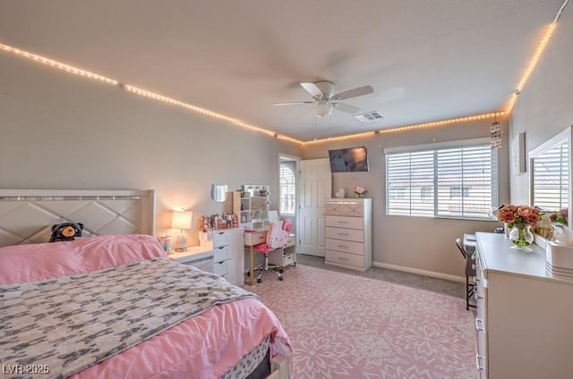 bedroom featuring a ceiling fan, baseboards, visible vents, and carpet flooring