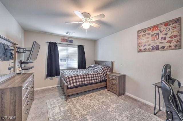 bedroom with light carpet, a ceiling fan, visible vents, and baseboards