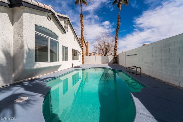 view of swimming pool with a fenced in pool, a patio, and a fenced backyard