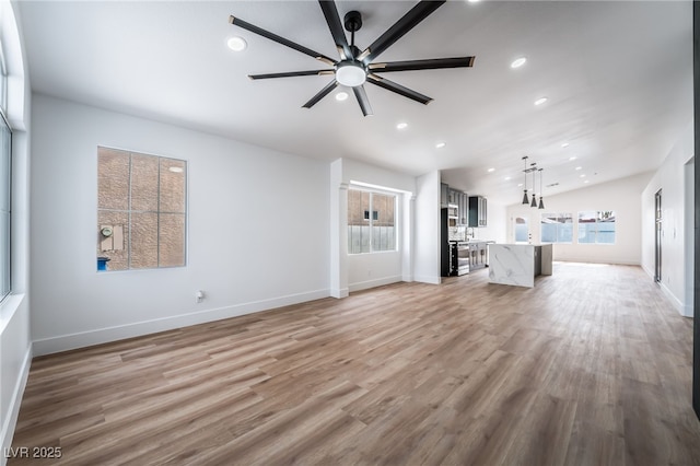 unfurnished living room featuring recessed lighting, baseboards, a ceiling fan, and light wood finished floors