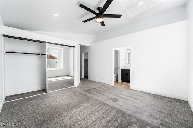 unfurnished bedroom with recessed lighting, baseboards, carpet flooring, and vaulted ceiling