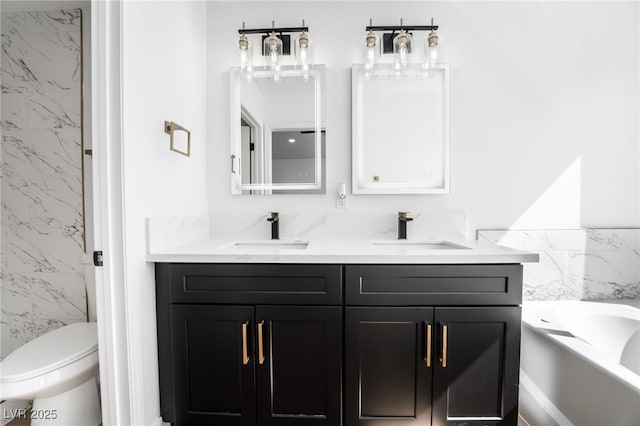 bathroom with a sink, a garden tub, tile walls, and double vanity