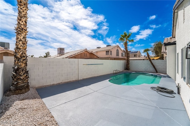 view of swimming pool with a patio area, a fenced in pool, and a fenced backyard