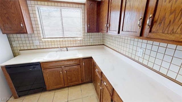 kitchen with a sink, decorative backsplash, dishwasher, and light countertops