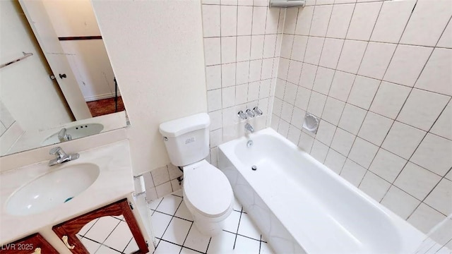 full bath featuring toilet, vanity, and bathtub / shower combination