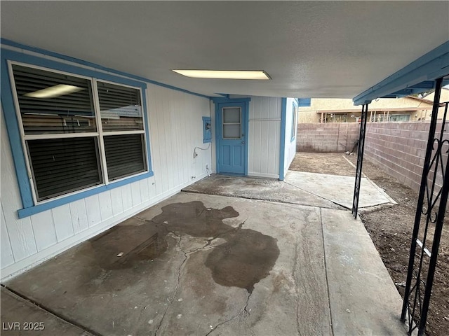 view of patio / terrace featuring fence