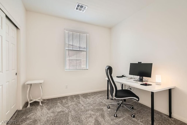 carpeted home office featuring visible vents and baseboards