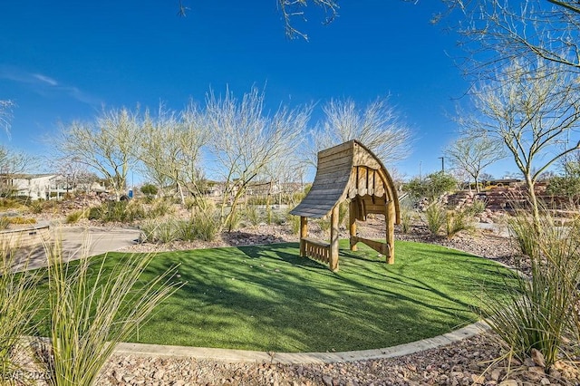 view of jungle gym with a yard