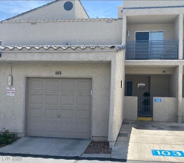 6250 W Flamingo Rd Unit 103, Las Vegas, NV 89103 - view of building exterior featuring a garage