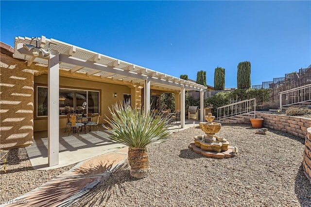 view of patio with a grill, fence, and a pergola