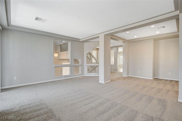 spare room featuring carpet, visible vents, baseboards, and recessed lighting