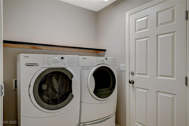 laundry area with laundry area and independent washer and dryer