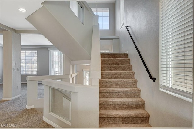 stairs with carpet floors, recessed lighting, and baseboards