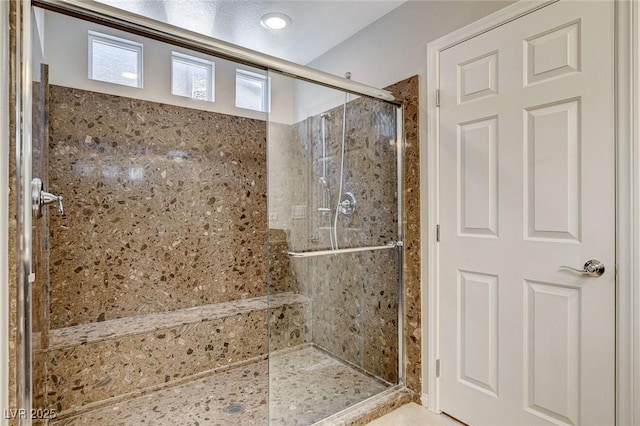 bathroom with a shower stall