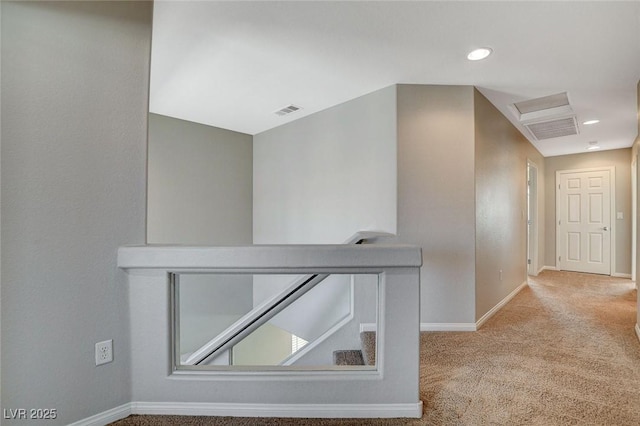 hall with carpet, recessed lighting, visible vents, stairway, and baseboards