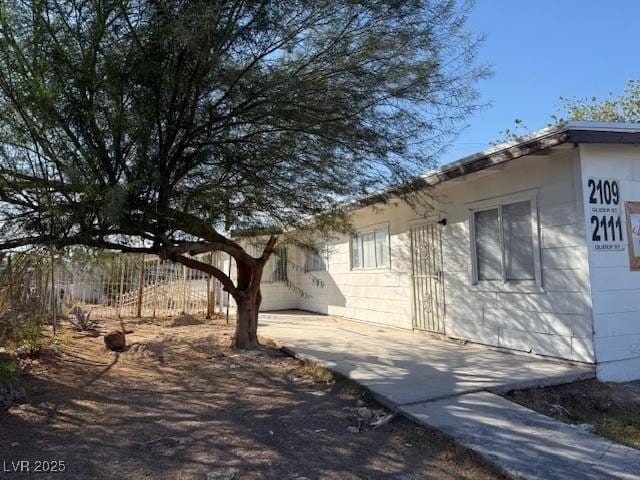 view of side of property with fence