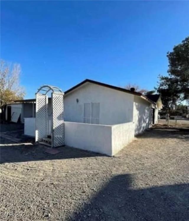 view of home's exterior with stucco siding