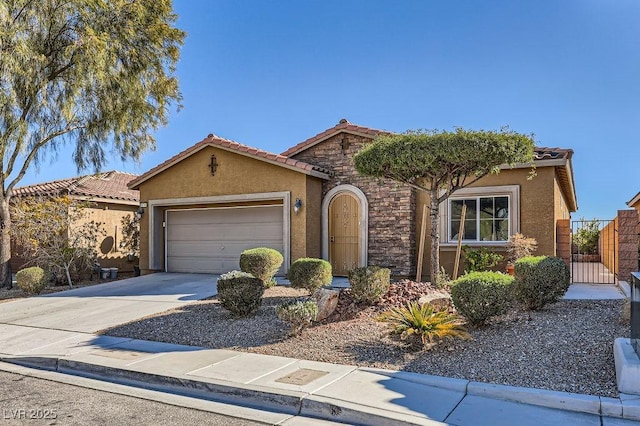 view of front of property featuring a garage, a tile roof, stone siding, driveway, and stucco siding