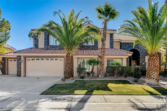 view of front of property with driveway, an attached garage, a tile roof, and stucco siding