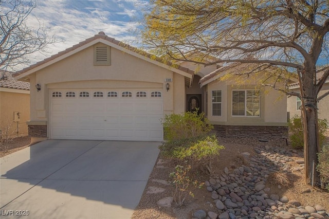 single story home featuring stucco siding, concrete driveway, a garage, stone siding, and a tiled roof