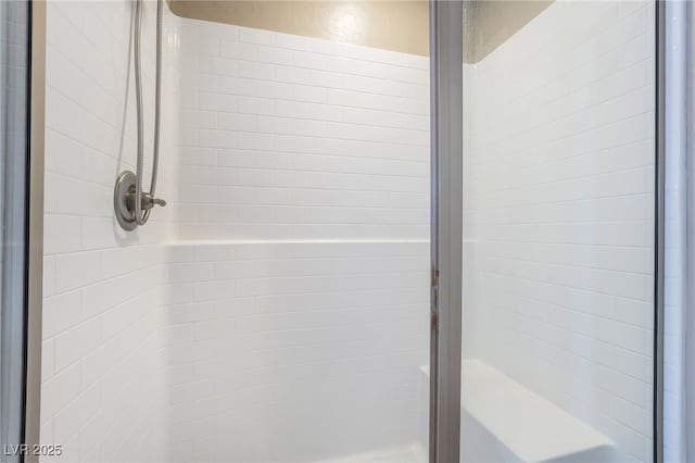 bathroom with a shower stall