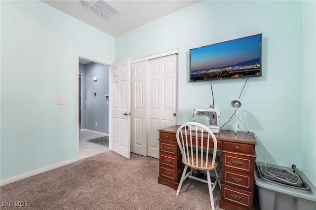 home office featuring baseboards, visible vents, and light colored carpet