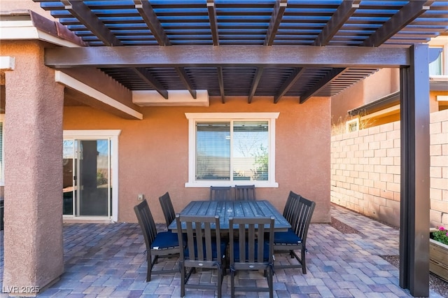 view of patio with outdoor dining area and a pergola